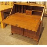 Oak dropfront bureau with two under drawers and double cupboards in Greek key decoration L: 97 cm