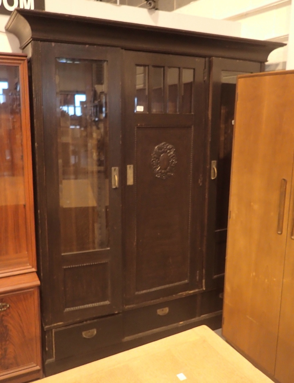 Oak bookcase with twin glazed doors central cupboard and three lower drawers H: 200 cm