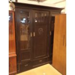 Oak bookcase with twin glazed doors central cupboard and three lower drawers H: 200 cm