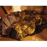 Shelf of military clothing including camoflauge