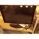 Samsung LCD TV with remote control and instruction book