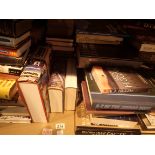 Shelf of assorted fact and fiction books mostly hardback