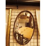 Wood framed bevel edged glass oval mirror 68 x 42 cm