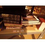 Shelf of assorted fact and fiction soft and hardback books