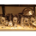 Shelf of mixed tankards goblets trays plate etc