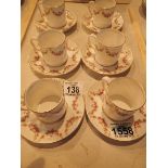 Six Tuscan floral coffee cans and saucers