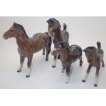 Four Beswick graduated horse and foal figurines