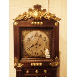 Long cased Westminster chime clock with brass decoration( key in office )