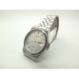 Seiko SQ100 wristwatch on a stainless steel bracelet CONDITION REPORT: Working at