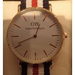 New and boxed Daniel Wellington yellow metal wristwatch with canvas strap