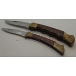 Two hardwood handled folding knives