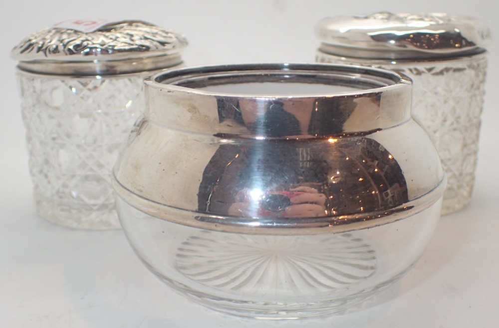 Three silver topped cut glass dressing table items two with lids