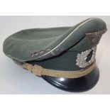 WWII German officers hat with badge CONDITION REPORT: Moth damage and hole to top.
