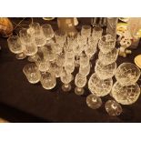 Collection of crystal drinking glasses including brandy snifters