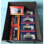 Seven assorted Hornby and Bachmann plank and tanker wagons boxed