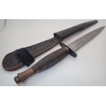 Fairbairn Sykes commando fighting knife in leather scabbard with metal top