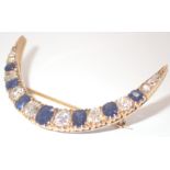 Cresent brooch with Burmese sapphires and diamonds set in high carat gold, approximately 3.