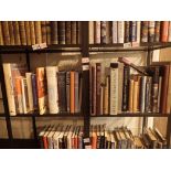 Two shelves of antiques and collectables reference books