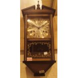 Westminster chiming Acctium oak cased wall clock