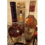 Quantity of mixed alcohol including bottle of Bells whisky Grants Courvoisier brandy and gift box