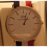 New and boxed Daniel Wellington yellow metal wristwatch with canvas strap