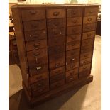 Haberdashery cabinet oak framed with forty drawers each with matching brass nameplates 126 x 49 x