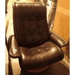 Brown leather armchair on swivel base