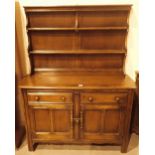 Medium ash Ercol dresser with two drawers over two cupboards