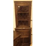 Leaded glass oak corner cabinet