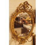 Georgian plaster gilt oval mirror with t