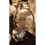 Chrome magnifying glass on wooden base