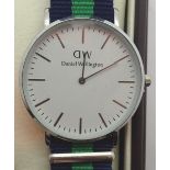 New and boxed stainless steel fashion wristwatch on a canvas strap marked DW