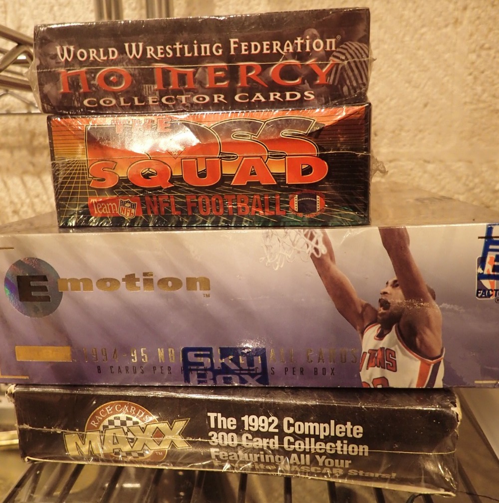 Four unopened sets of trading cards The Boss Squad 1994 fifteen NBA WWF no march and Nascar 5th