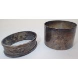 Two hallmarked silver napkin rings one in presentation box