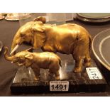 Hollow bronze and copper elephant mother and calf on a marble base H: 15 cm including base L: 20 cm