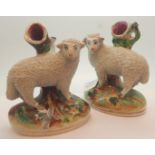 Pair of Staffordshire sheep spill vases H: 14 cm
