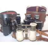 Two pairs of vintage binoculars and a pair of opera glasses