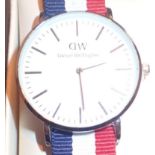 ***WITHDRAWN*** New and boxed stainless steel fashion wristwatch on a canvas strap marked DW