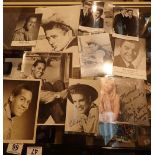 Two James Dean photographs largest 23 x 18 cm three Emile Ford photographs including a signed