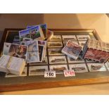 Trade cards and a framed cigarette card set