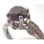 9ct white gold black diamond solitaire with white diamonds set in the mount approximately 1.