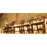 Six upholstered dining chairs with carved splats