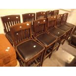 Set of ten matching tall stools with backs wood and black leather seats with studding H: 78 cm
