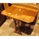 Small mahogany dropleaf table with turned legs and stretcher with ceramic castors