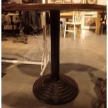 Single pedestal round based cast iron pub table with circular wooden top D: 76 cm H: 76 cm