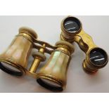 Two mother of pearl gilt metal opera glasses