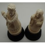 Two antique ivory Indian hand carved figurines on turned wooden plinth CONDITION REPORT: