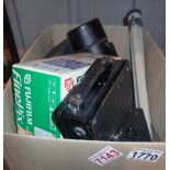 Box of vintage camera equipment including lenses