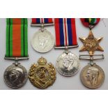 Two WWII war medals two defence medals a Pacific Star and a Royal Engineers cap badge