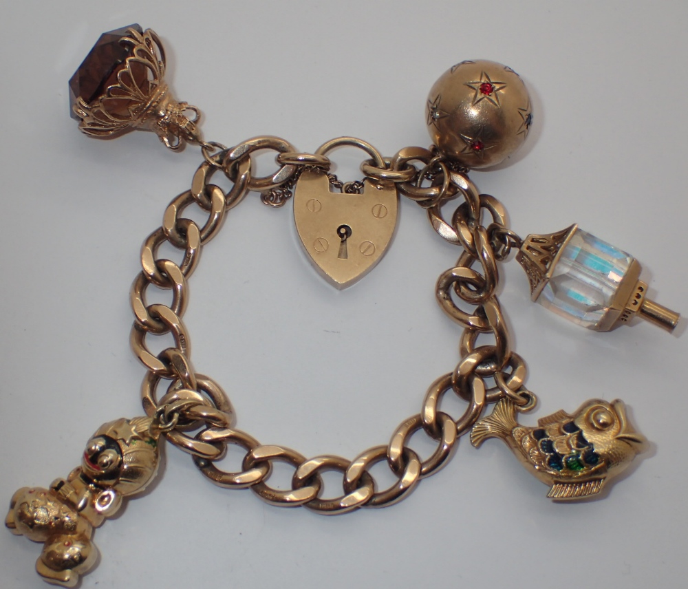 9ct gold bracelet with charms 49.